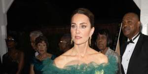 Duchess Catherine wore a custom emerald gown by British designer Jenny Packham.
