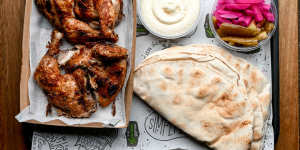 Whole chicken plate with pickles,pita and toum (tangy garlic sauce).