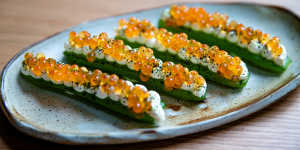  Pressed cucumber with smoked sour cream and salmon roe.