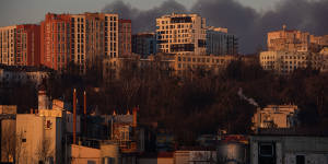  Smoke is seen above apartment blocks on March 18,2022 in Lviv,Ukraine. Lviv’s mayor said on Telegram that the airport was not hit,but an area nearby.