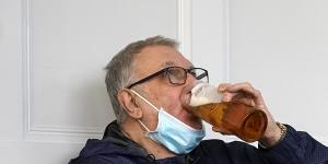 People drink beer in a Liverpool city centre pub ahead of the lockdown closure of bars,gyms and clubs in Liverpool,England. 