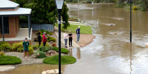 Echuca residents watching the water rise on Campaspe Esplanade on Sunday.