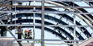 The steel ribs are exposed as the Wran Building is demolished. 
