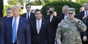 Front from left:Donald Trump,former defence secretary Mark Esper and chairman of the Joint Chiefs of Staff,General Mark Milley,in June.
