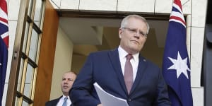 Then-prime minister Scott Morrison and then-treasurer Josh Frydenberg arrive at a press conference to announce the superannuation withdrawal policy in March 2020.