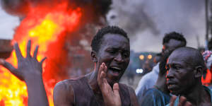 Opposition supporters protest the deputy president’s candidacy last week.