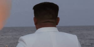 North Korean leader Kim Jong Un oversees a strategic cruise missile test aboard a navy warship.
