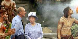 The Queen and the Duke of Edinburgh watch a culture show at Tjapukai Aboriginal Culture Park,Cairns.