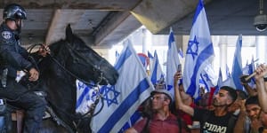 Mounted police disperse demonstrators trying to block the entrance to Israel’s main international airport.