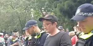 Parry during his arrest outside Parliament House in Brisbane.