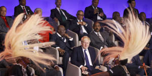 Ruffled:British Prime Minister Boris Johnson,centre,looks at traditional dancers performing during the opening ceremony of the Commonwealth Heads of Government Meeting (CHOGM) in Kigali,Rwanda.