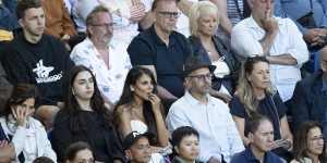 Alex Waislitz in a black fedora with fiance Rebekah Behbahani,at left,at the Australian Open men’s final.