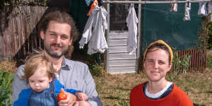 Zak Hamer,wife Erin Mould and son Reuben Hamer,in their garden in Castlemaine.