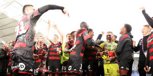 Wanderers players celebrate in front of the CommBank Stadium faithful.