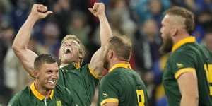 South African players celebrate after beating France.