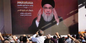Hezbollah leader Hassan Nasrallah greets his supporters via a video link,during a rally in Beirut,Lebanon.