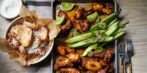 Charred tandoori chicken wings with crunchy coconut potatoes.