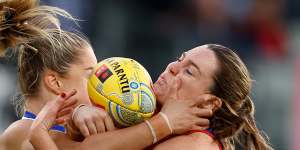 The Kangaroos’ Alice O’Loughlin and Melbourne’s Maeve Chaplin battle for the ball.