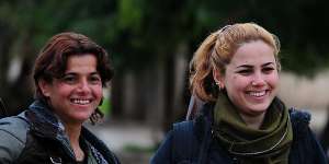 Young women guard the Asayish (Kurdish intelligence agency) headquarters in Tel Tamer,where Islamic State militants had earlier attacked a string of Assyrian villages along the Khabur River,kidnapping at least 220. 