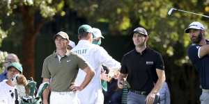 Rivals lessen gap to Johnson at Masters