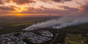 Sunshine Coast motorway reopened as bushfire threat eases slightly