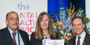 Professor Darryl Maybery and Professor Andrea Reupert are presented with an award by federal Health Minister Greg Hunt in Brisbane.