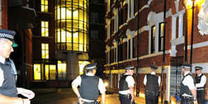 Police outside the Ecuadorian Embassy in London where Julian Assange is seeking political asylum. Photo:Paul Stewart