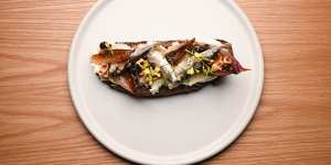 Sardines on toast with sweet-sour onion,currants soaked in tea and toasted hazelnuts.