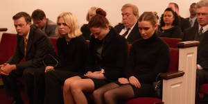 A family in mourning (from left):Clayton Peterson (Dane DeHaan),Martha Ratliff (Odessa Young),Margaret Ratliff (Sophie Turner) and Caitlin Atwater (Olivia DeJonge).