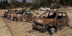 Destroyed vehicles in the Israeli kibbutz of Kfar Aza,which was attacked by Hamas on October 7.