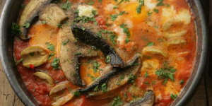 Field mushrooms and eggs in the pan.