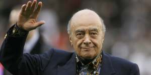 Mohamed Al Fayed waves to the crowd before an English Premier League soccer match in 2008.