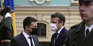 French President Emmanuel Macron,right,is welcomed by Ukrainian President Volodymyr Zelensky before their talks in Kyiv.