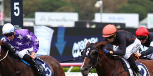 Jason Collett rides Semana (right) to victory in the Triscay Stakes.