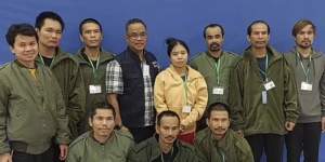 In this photo provided by Thailand’s Foreign Ministry,the first 10 freed Thai hostages and an officer (fourth from left),are pictured at Israel’s Shamir Medical Centre.
