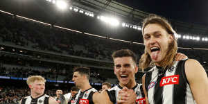 Nick Daicos and Darcy Moore celebrate after their side’s win over the Blues recently.