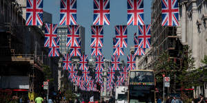 Bunting for the coronation of King Charles III adorns Regent Street in central London.