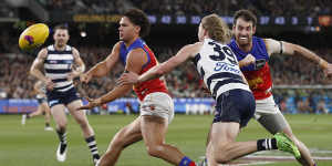 Brisbane’s Cam Rayner gets a handball away.