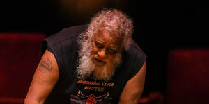 Uncle Howard Talgium “Choco” Edwards pays tribute to Uncle Jack Charles at the state funeral service at Melbourne’s Hamer Hall on Tuesday. 