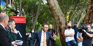 Auctioneer Damien Cooley of Cooley Auctions prepares to sell the home.
