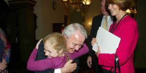 John Tingle hugs his granddaughter Tosca in 2006,when he retired from politics.