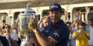 Phil Mickelson holds the Wanamaker Trophy after winning the 2021 PGA Championship.