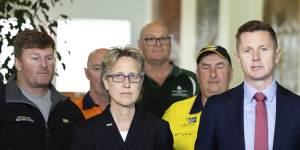 Dan Walton in Parliament House on Tuesday,flanked by ACTU secretary Sally McManus and union members,calling for government to cap coal prices.