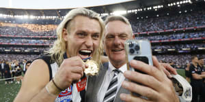A grand final with Moore:Collingwood skipper Darcy Moore with his famous father.