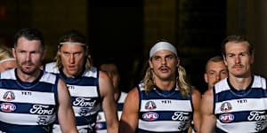 Patrick Dangerfield,Bailey Smith and Tom Stewart of the Cats lead their team out.