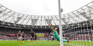 Jarrod Bowen beats Arsenal goalkeeper Aaron Ramsdale to score for West Ham.