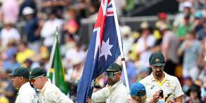 The Test team with the Australian flag at the Gabba during the series against South Africa in 2022.