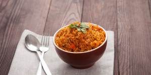 Jollof rice,with tomatoes and hot peppers.