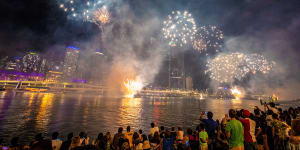 Night sky lights up for New Year's Eve as crowds flock to Brisbane River