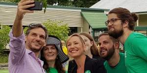 Queensland Greens senator Larissa Waters (centre) posing for a photo at Rainworth State School on Saturday with supporters and state member for Maiwar Michael Berkman.